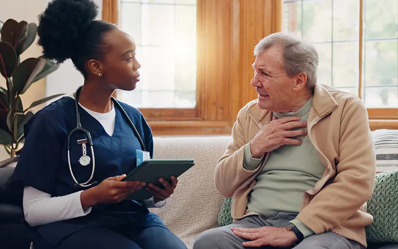 woman helping elderly man